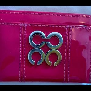 Authentic Coach card holder - pink in color.